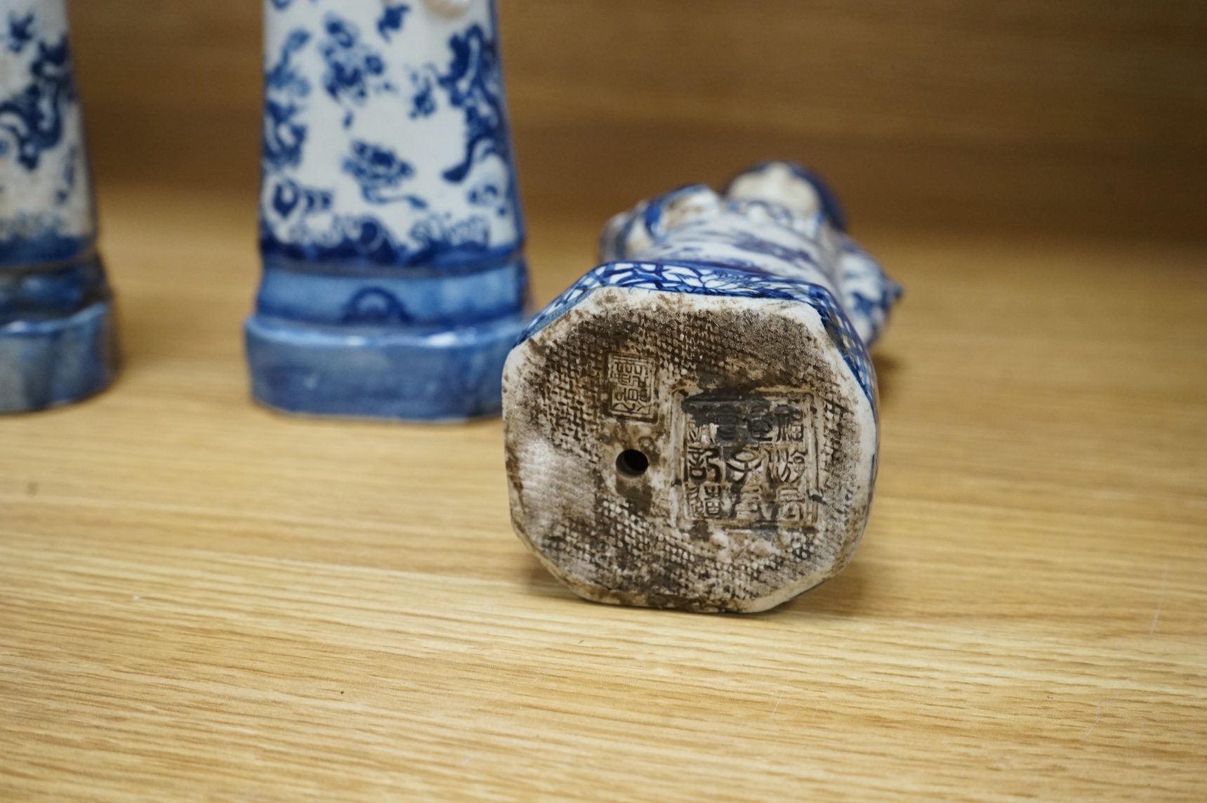 Three Chinese blue and white porcelain figures H 29cm x 9cm., and a Delft tobacco jar H 26cm W 18cm